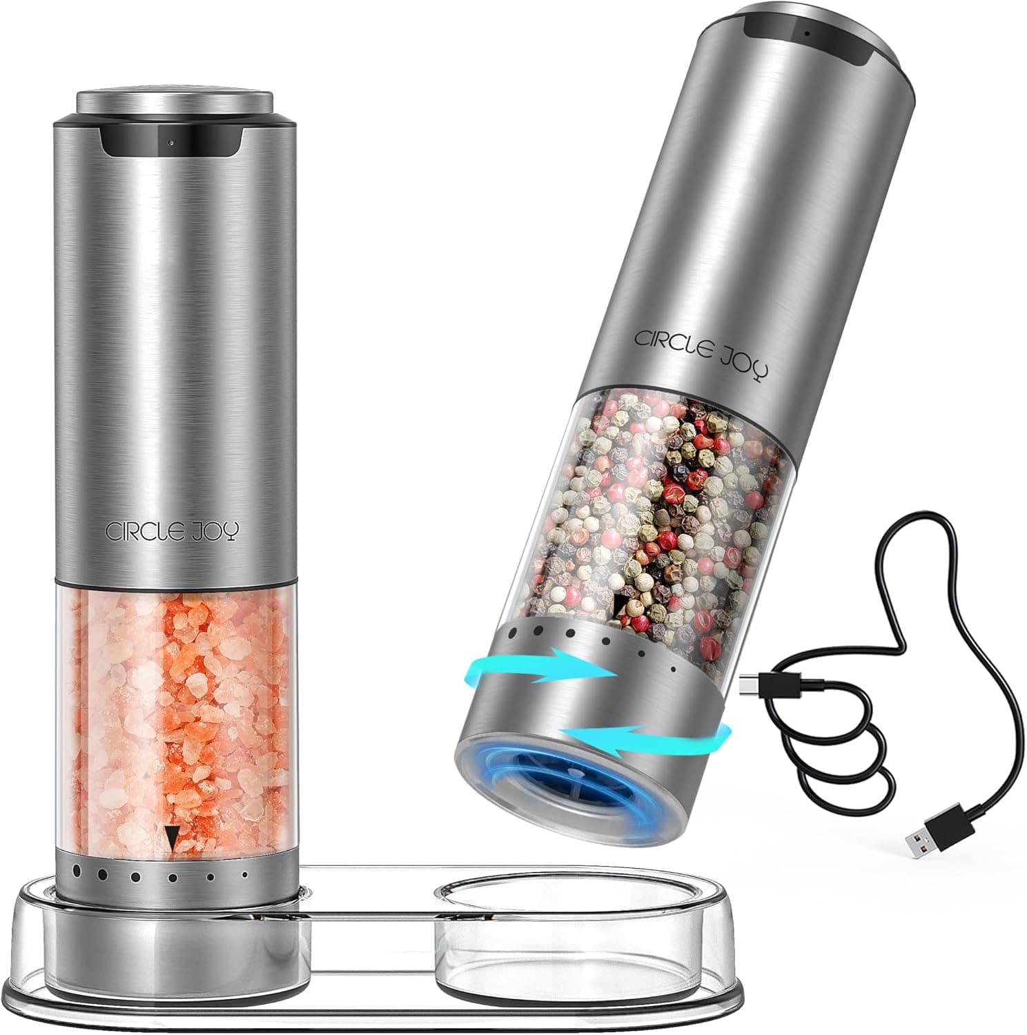 A pair of slim stainless steel electric salt and pepper mills standing upright on a small round base
