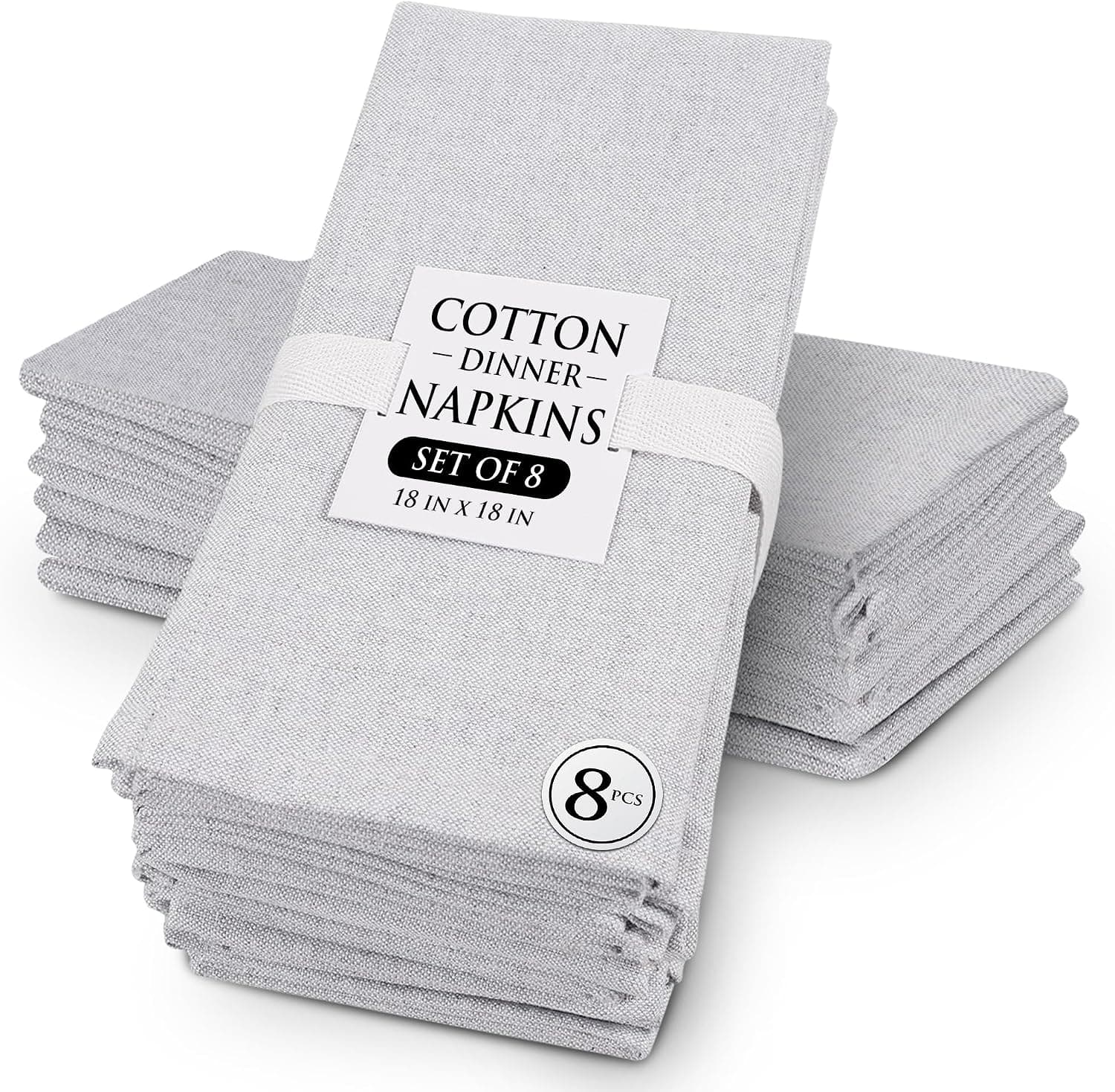 Grey chambray cloth napkins, folded and stacked, with a soft woven texture
